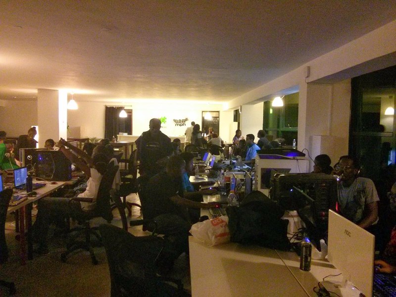 A packed community LAN game night with players at every station